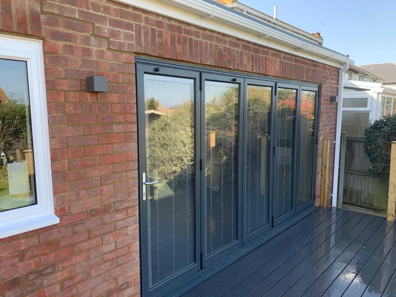 Extension with full height doors in Ashford