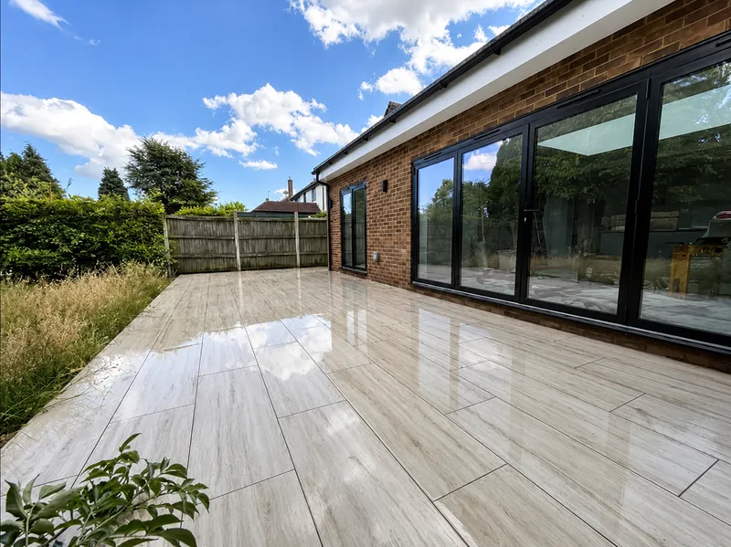 Completed rear extension with bifold doors and porcelain patio
