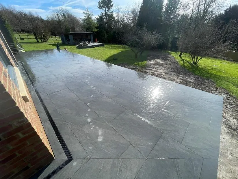 Slate porcelain garden patio with channel drainage